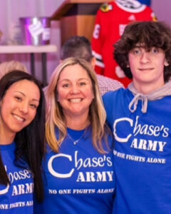 Three members of Chase's gift a Burlington Charity.