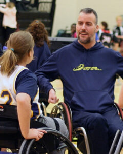 Chris Chandler and one of his wheelchair basketball players. 